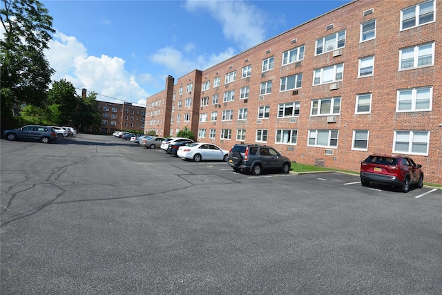 100 S Ocean Ave Unit 4A, Freeport, NY 11520 - view of apartment building / complex with uncovered parking