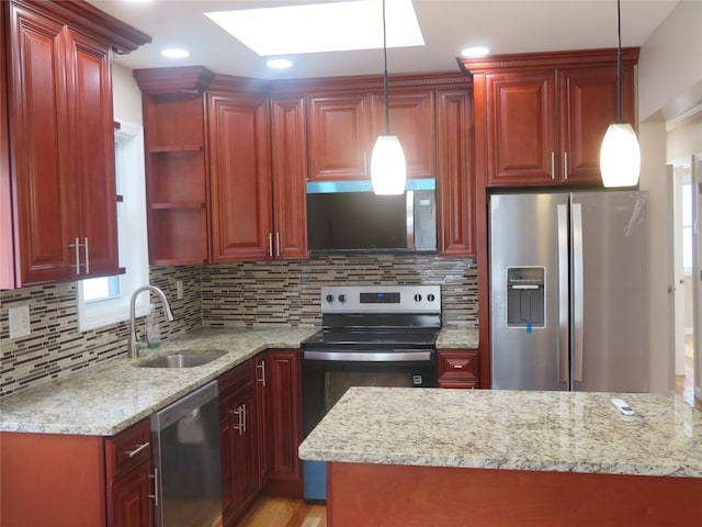 118 Muncy Ave, West Babylon, NY 11704 - kitchen with stainless steel appliances, a skylight, decorative light fixtures, light stone countertops, and decorative backsplash