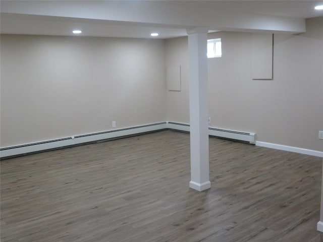 118 Muncy Ave, West Babylon, NY 11704 - below grade area featuring wood finished floors, recessed lighting, and baseboard heating