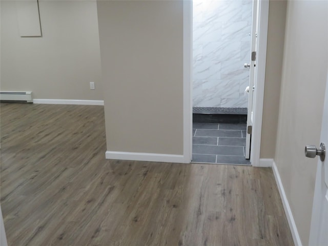 118 Muncy Ave, West Babylon, NY 11704 - empty room featuring wood finished floors and a baseboard radiator