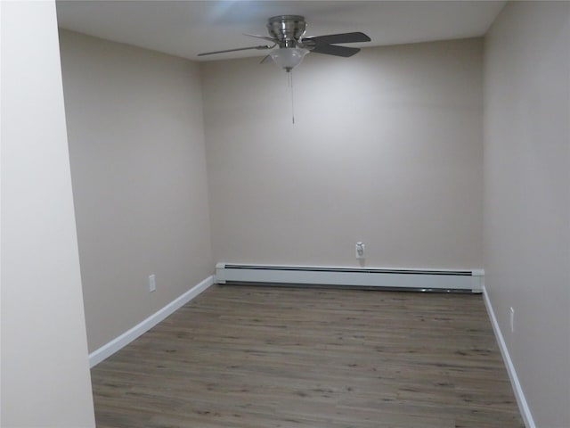 118 Muncy Ave, West Babylon, NY 11704 - empty room with a ceiling fan, baseboard heating, and wood finished floors