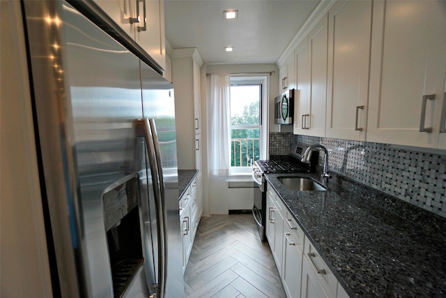 7281 113th St Unit 5F, Forest Hills, NY 11375 - kitchen featuring stainless steel appliances, white cabinetry, backsplash, and dark stone counters
