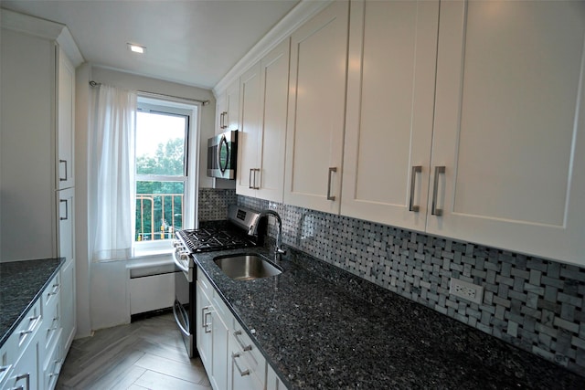 7281 113th St Unit 5F, Forest Hills, NY 11375 - kitchen with stainless steel appliances, white cabinetry, backsplash, and dark stone counters