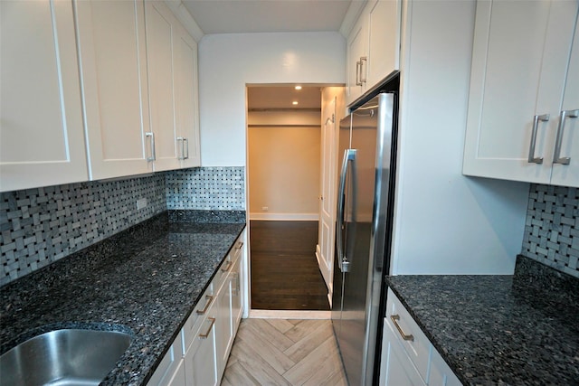 7281 113th St Unit 5F, Forest Hills, NY 11375 - kitchen with freestanding refrigerator, white cabinets, tasteful backsplash, parquet floors, and recessed lighting