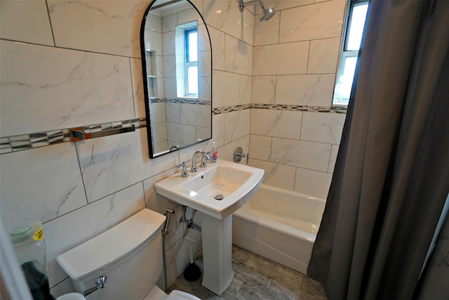 7281 113th St Unit 5F, Forest Hills, NY 11375 - bathroom featuring tile walls and shower / bath combo with shower curtain