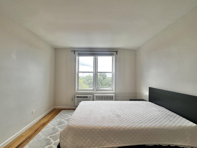 210-50 41st Ave Unit 6B, Bayside, NY 11361 - bedroom featuring light wood finished floors and radiator
