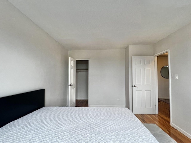 210-50 41st Ave Unit 6B, Bayside, NY 11361 - bedroom with wood finished floors and a closet
