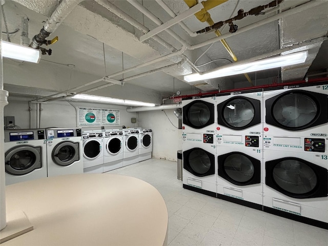 210-50 41st Ave Unit 6B, Bayside, NY 11361 - shared laundry room featuring stacked washing machine and dryer, washer and clothes dryer, and tile patterned floors