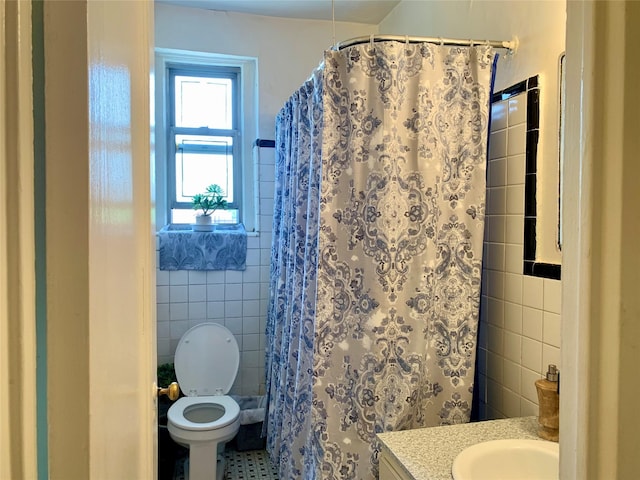 511 W 232nd St Unit E56, Bronx, NY 10463 - bathroom featuring tile walls, vanity, tile patterned flooring, and curtained shower
