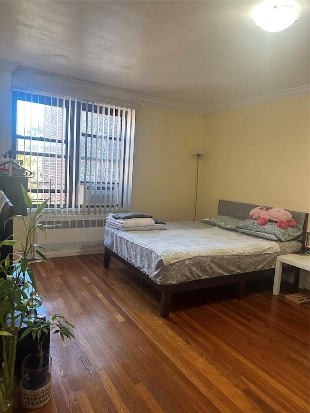 150-30 71st Ave Unit 4F, Kew Garden Hills, NY 11367 - bedroom featuring wood finished floors, multiple windows, crown molding, and radiator heating unit