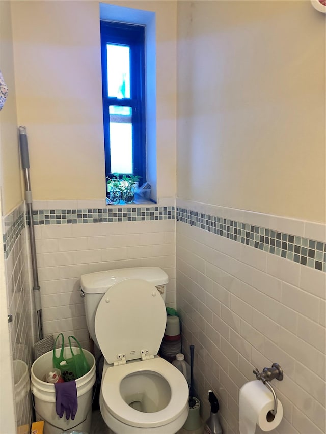 150-30 71st Ave Unit 4F, Kew Garden Hills, NY 11367 - bathroom with tile walls and a wainscoted wall