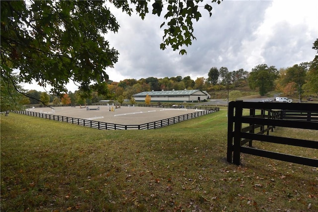 surrounding community with a lawn and a rural view