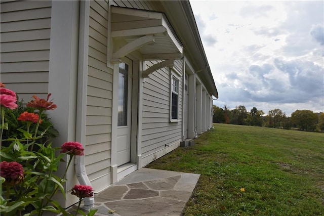 view of home's exterior featuring a lawn