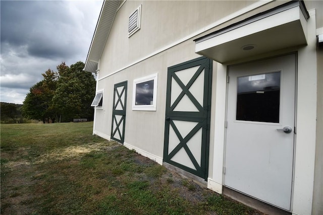 view of outdoor structure with a lawn