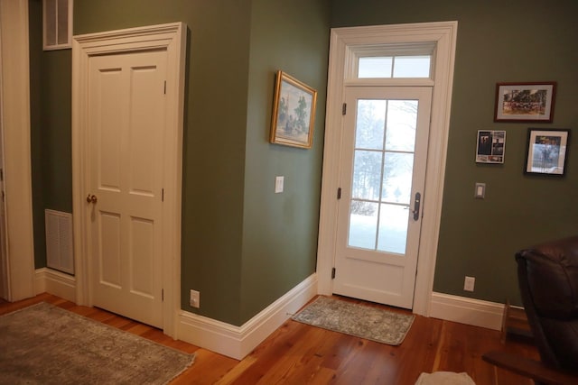 entryway with hardwood / wood-style floors