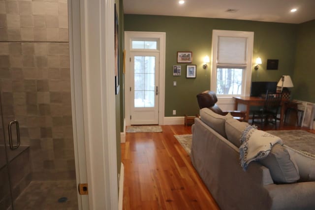 living room featuring a healthy amount of sunlight and hardwood / wood-style floors