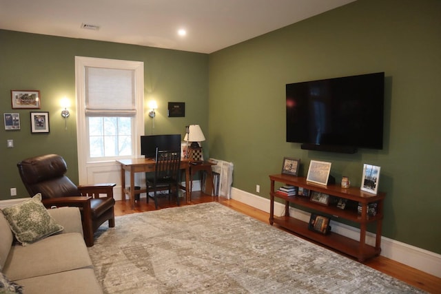 office with hardwood / wood-style flooring