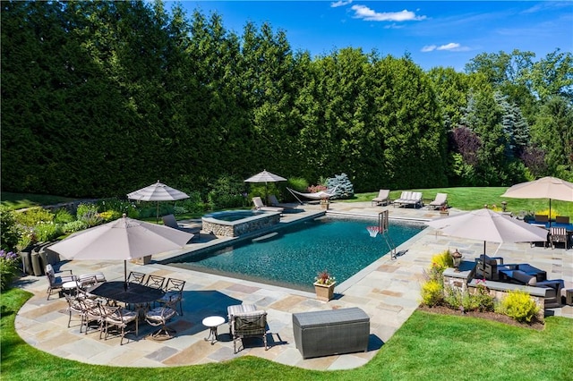 view of pool with a yard, an in ground hot tub, and a patio