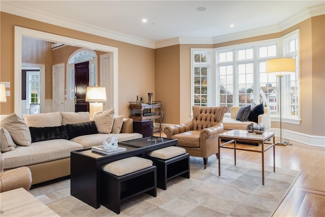 interior space featuring a wealth of natural light, crown molding, and light wood-type flooring