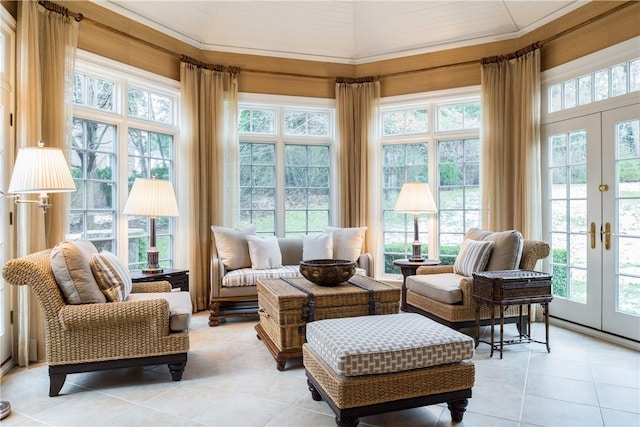 sunroom featuring french doors and a healthy amount of sunlight