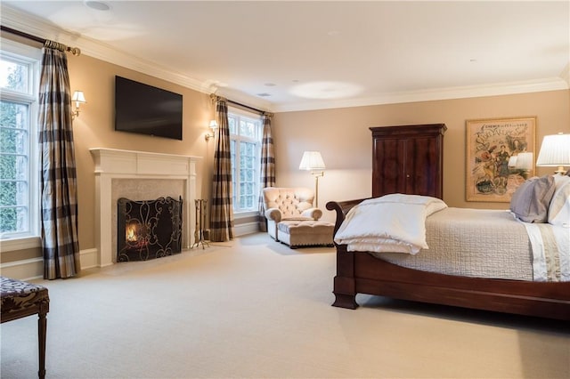 bedroom featuring ornamental molding and carpet floors