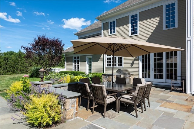 view of patio / terrace featuring french doors and exterior kitchen