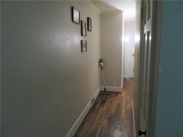 corridor with dark wood-type flooring