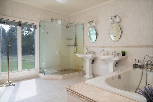 bathroom featuring separate shower and tub, plenty of natural light, and ornamental molding