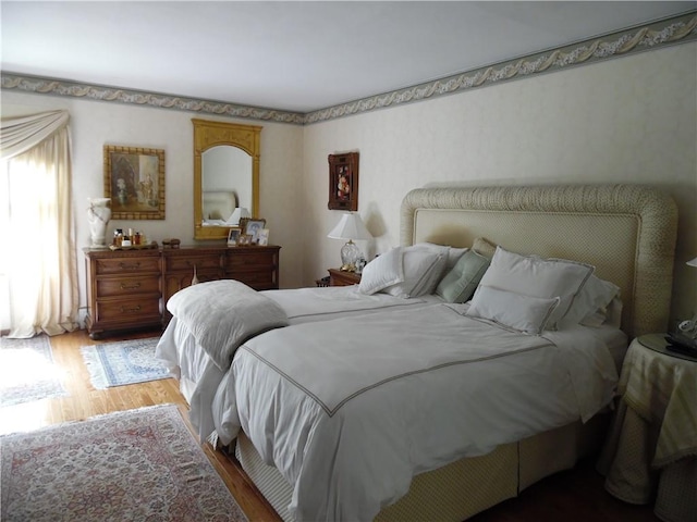 bedroom featuring wood-type flooring