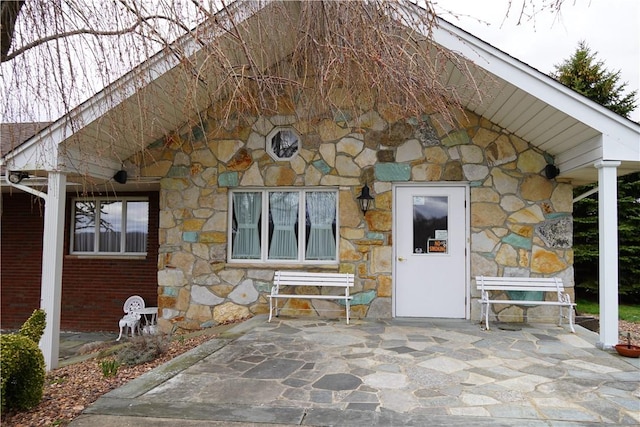 doorway to property featuring a patio