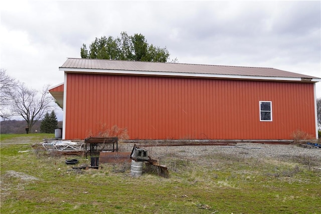 view of side of home with an outdoor structure