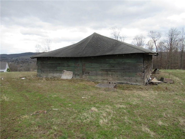 view of side of home featuring a yard