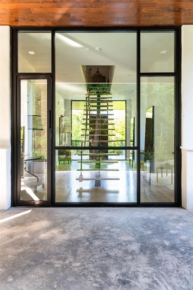 interior space featuring expansive windows and concrete floors