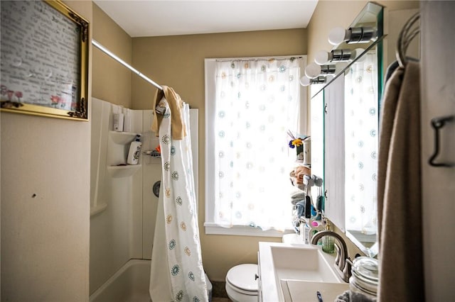 full bathroom featuring vanity, toilet, and shower / tub combo