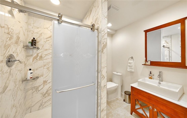 bathroom featuring walk in shower, vanity, and toilet