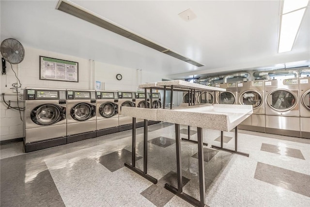 clothes washing area with independent washer and dryer