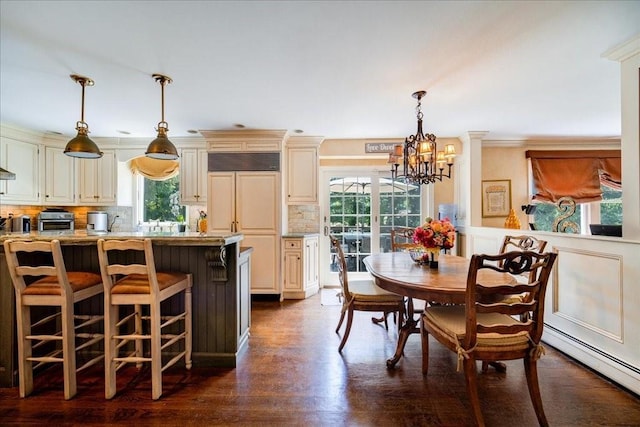 10 Evergreen Ct, Suffern, NY 10901 - kitchen with a baseboard heating unit, a chandelier, healthy amount of natural light, cream cabinets, and ornamental molding