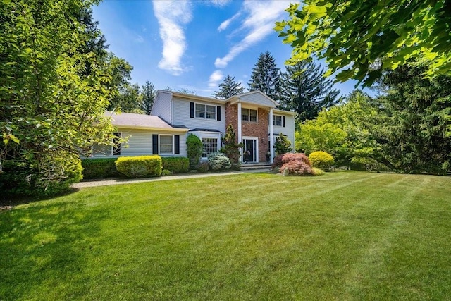 10 Evergreen Ct, Suffern, NY 10901 - greek revival house with a front yard and brick siding