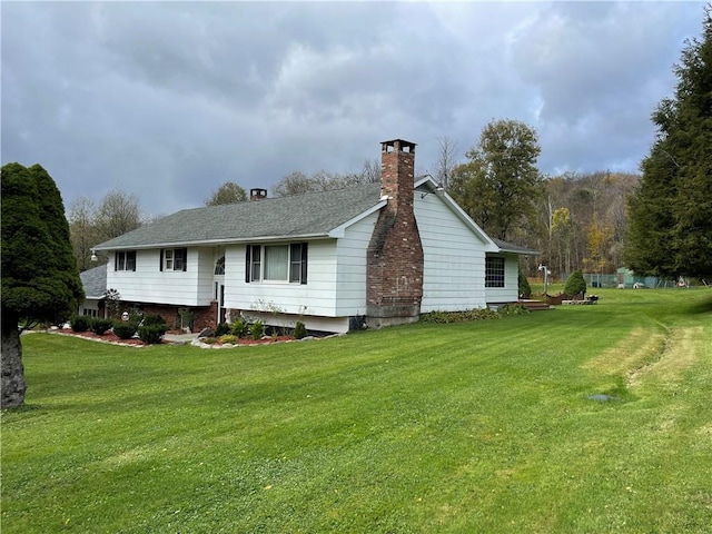 rear view of property featuring a yard