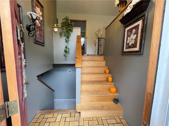 staircase featuring tile patterned floors