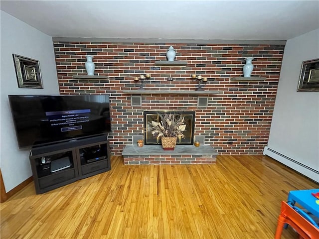 living room featuring light wood-type flooring and a baseboard radiator