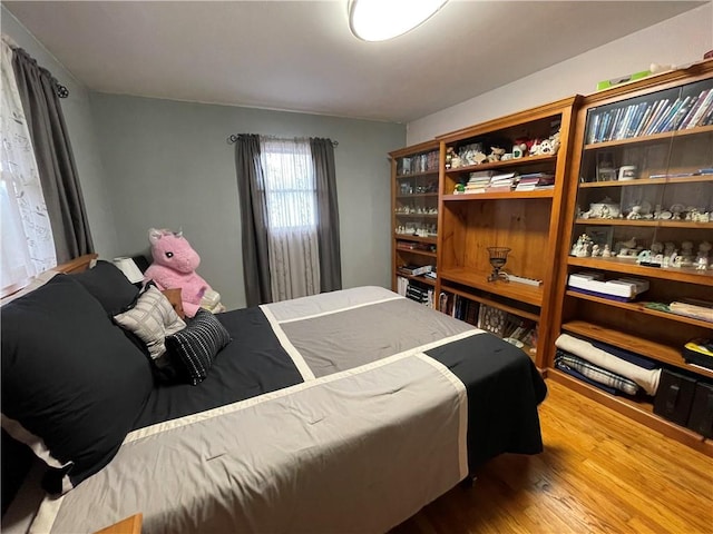 bedroom featuring hardwood / wood-style floors