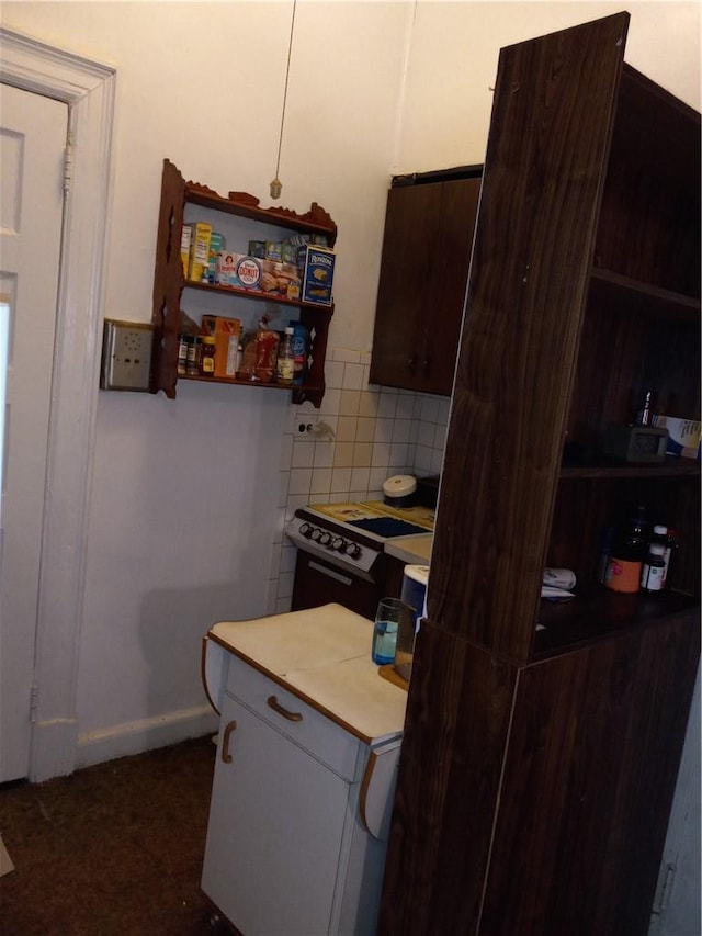 kitchen with decorative backsplash and range with electric cooktop