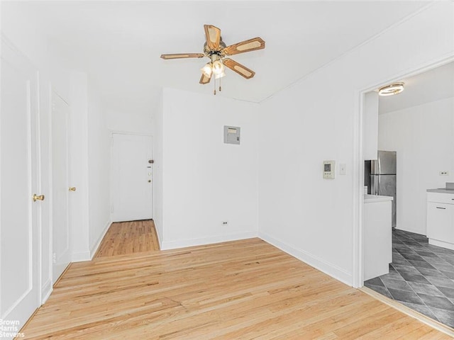 unfurnished room featuring ceiling fan and wood-type flooring