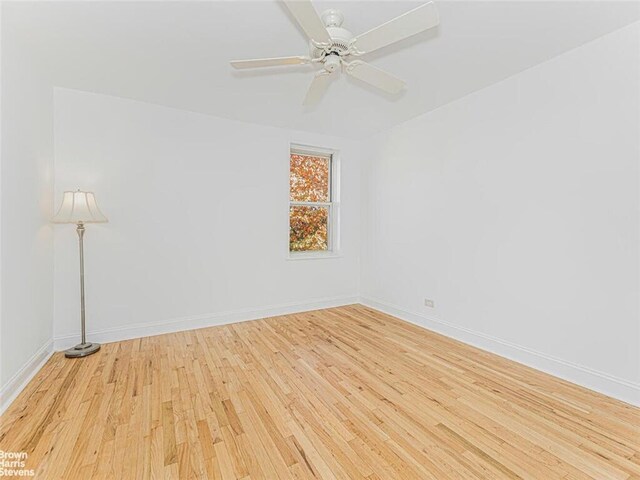 empty room featuring light hardwood / wood-style floors and ceiling fan