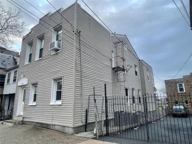 view of side of home with cooling unit