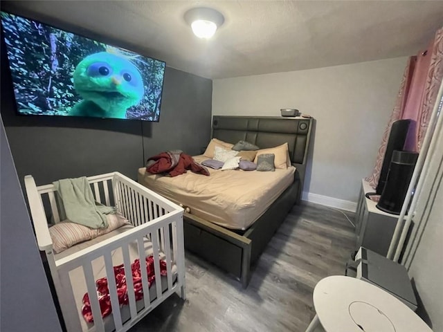 bedroom featuring hardwood / wood-style floors