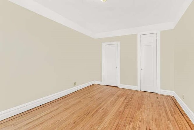 unfurnished bedroom featuring light wood-type flooring