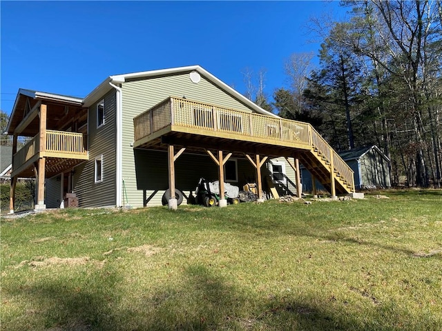 rear view of house with a lawn and a wooden deck