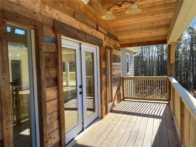 deck with ceiling fan and french doors